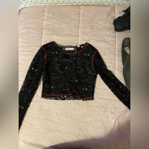 mesh long sleeve with skull designs and red border